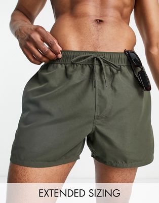 ASOS DESIGN swim shorts in short length in khaki-Green