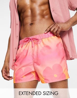 ASOS DESIGN swim shorts in short length with faded floral print in pink