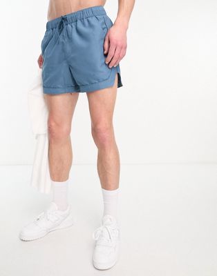 ASOS DESIGN swim shorts in short length with piping detail in turquoise-Blue