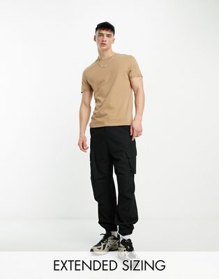 ASOS DESIGN t-shirt with roll sleeve in tan-Neutral