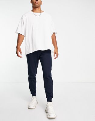 ASOS DESIGN tapered joggers in navy