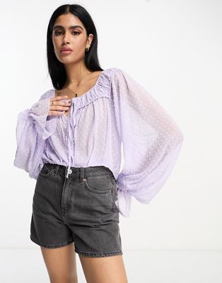 ASOS DESIGN textured blouse with volume sleeves & tie front in lavender-Purple