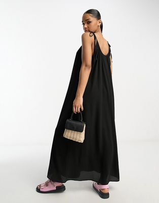 ASOS DESIGN tie strap detail trapeze maxi slip dress in black
