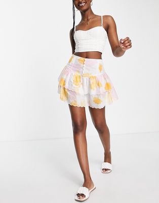 ASOS DESIGN tiered button front mini skirt with scalloped hem in washed floral-Multi