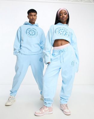 ASOS DESIGN unisex co-ord relaxed sweatpants with print in blue wash