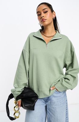 ASOS DESIGN Washed Half Zip Sweatshirt in Mid Green