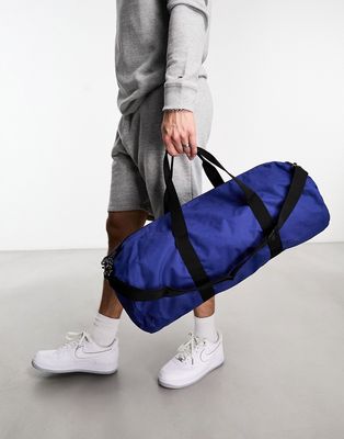 ASOS DESIGN weekend holdall barrel bag in blue nylon with contrast puller