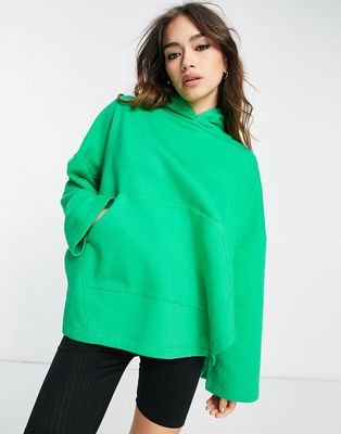 ASOS EDITION oversized hooded sweatshirt with slit sides in bright green