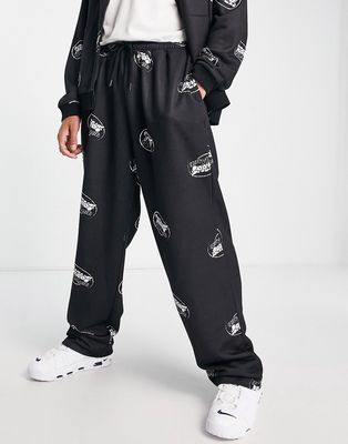 ASOS Unrvlld Spply oversized low-rise sweatpants with all over logo print in black - part of a set