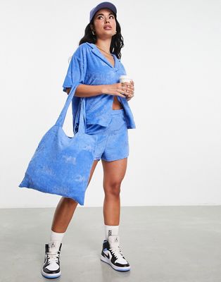 ASOS Weeekend Collective tote bag in towelling with WCA burn out in blue