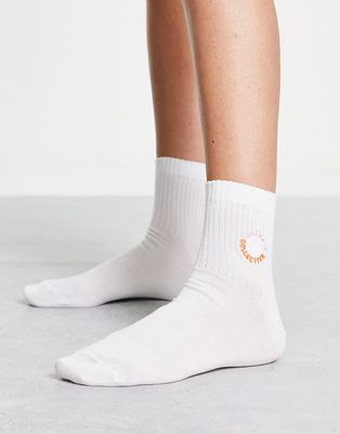 ASOS Weekend Collective ankle rib socks with pink and orange embroidered logo in white