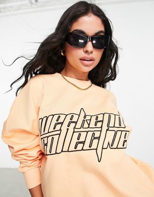 ASOS Weekend Collective boxy sweatshirt with futuristic logo in apricot - part of a set-Orange