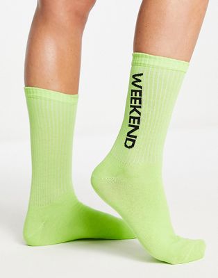 ASOS Weekend Collective calf length rib socks with horizontal split logo in lime-Green