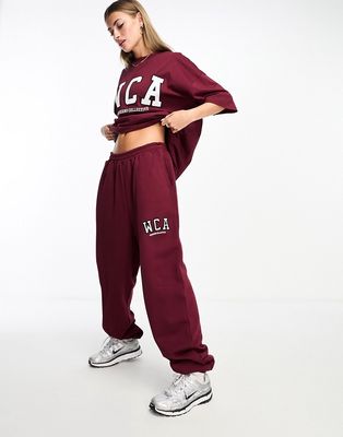 ASOS Weekend Collective oversized sweatpants with WCA logo in burgundy-Red