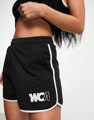 ASOS Weekend Collective runner short with tipping and WCA logo in black