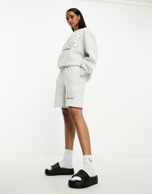 ASOS Weekend Collective sweat shorts with varsity logo in ice heather-Gray