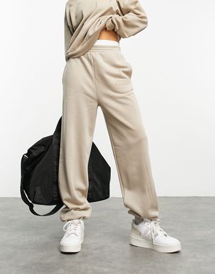 ASOS Weekend Collective sweatpants in washed neutral with wca logo-Pink