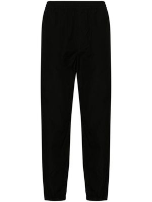 Auralee tapered-leg wool trousers - Black