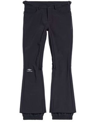 Balenciaga logo-print press-stud flared trousers - Black