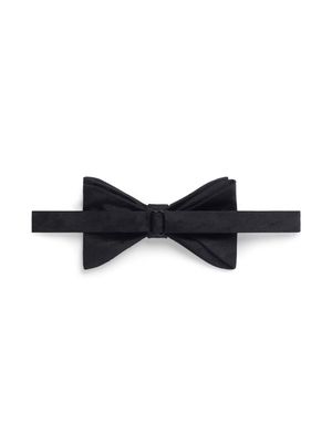 Balenciaga silk Nothing says suave and sophisticated quite like a bow tie. This black silk velvet bow tie from Saint Laurent is all you need to add...
