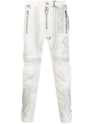 Balmain embroidered-design tapered leather trousers - White