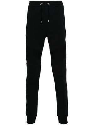 Balmain logo-flocked cotton track pants - Black