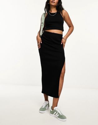 Bershka body-conscious knitted midi skirt in black