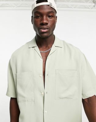 Bershka double pocket relaxed shirt in sage-Green