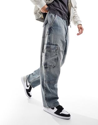 Bershka skater cargo pocket jeans in mid blue