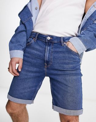 Bershka skinny denim roll up shorts in dark blue