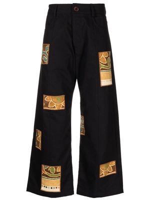 Bethany Williams patch-detail cropped trousers - Black