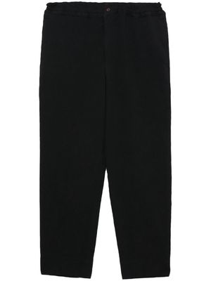 Black Comme Des Garçons cropped elasticated trousers