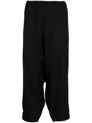 Black Comme Des Garçons drop-crotch cropped trousers