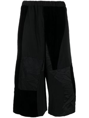 Black Comme Des Garçons elasticated cropped trousers