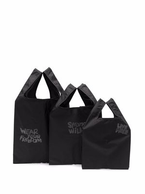 Black Comme Des Garçons set-of-three slogan-print tote bags