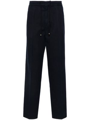 Brunello Cucinelli pressed-crease loose-fit trousers - Blue