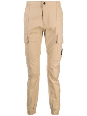 Calvin Klein Jeans logo-appliqué elasticated-waistband straight-leg trousers - Brown