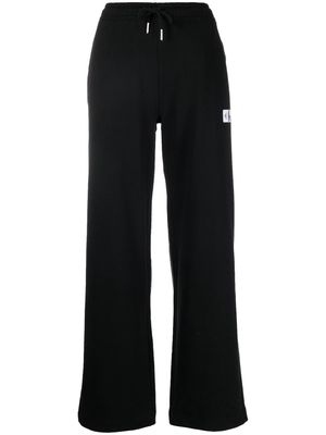 Calvin Klein Jeans logo-patch wide-leg sweatpants - Black