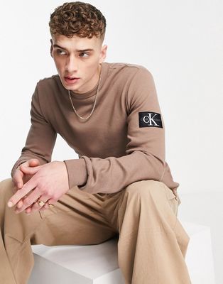 Calvin Klein Jeans monologo badge waffle slim fit long sleeve top in tan-Brown
