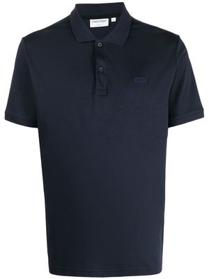 Calvin Klein logo-patch cotton polo shirt - Blue