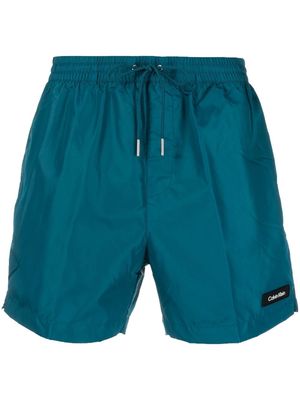 Calvin Klein logo-patch detail swim shorts - Blue