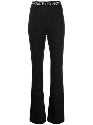 Calvin Klein logo-waistband flared leggings - Black