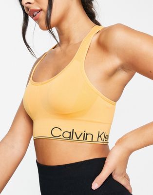 Calvin Klein Performance medium impact v-neck racerback seamless sports bra with removable cups in yellow-Brown