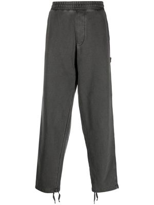 Carhartt WIP distressed-effect track pants - Grey