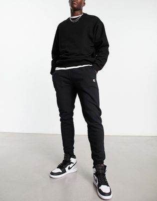 Champion small logo tracksuit bottoms in black