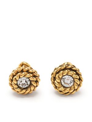 Chanel Pre-Owned 1970s twisted edge rhinestone cuff links - Gold