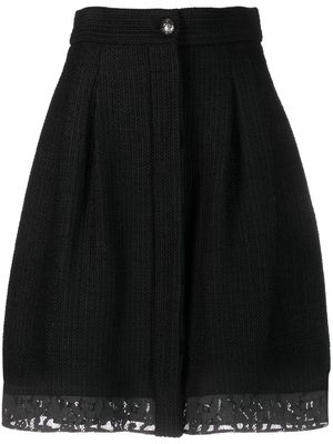 CHANEL Pre-Owned 2000s lace-trim bouclé skirt - Black