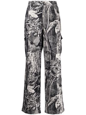 Children Of The Discordance graphic-print cotton trousers - Black