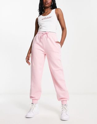 COLLUSION branded oversized sweatpants in pink