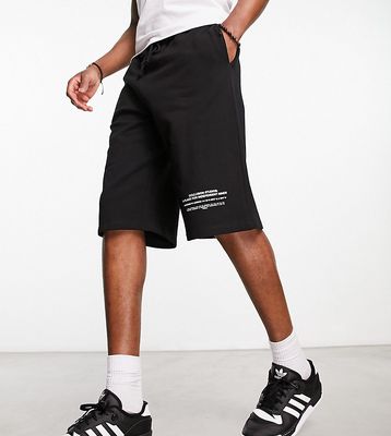 COLLUSION long board shorts in black